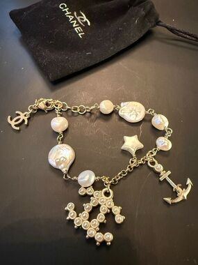 CHANEL Silver Tone Bracelet With Charms and Pearls